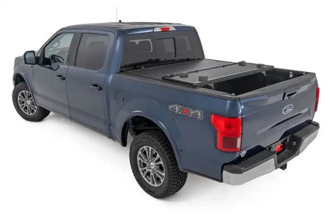 Rough Country 47220550 - Hard Tri-Fold Tonneau Bed Cover 5'7" Bed FORD F-150 (15-20)/Raptor (17-20)